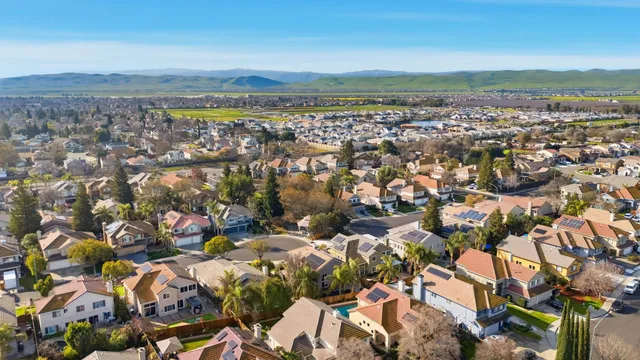 a aerial view of a house with a swimming pool