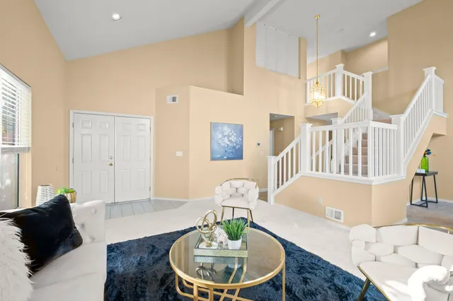 a living room with furniture and a table