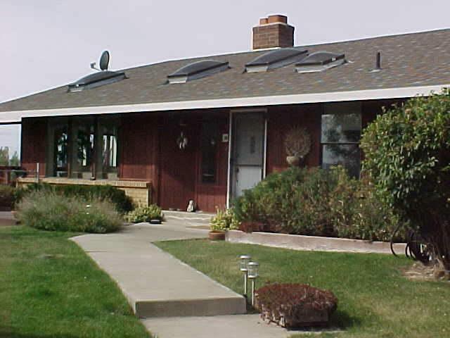 100 Coombs Road Moxee, WA 98936 - Photo 1 of 9 a front view of a house with a yard