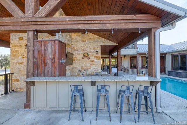 a kitchen with a table and chairs in it