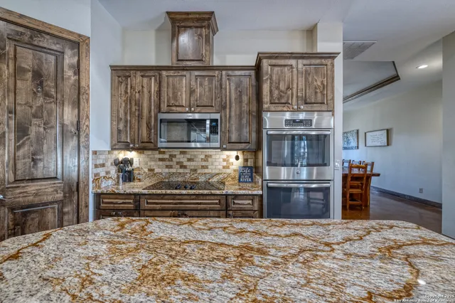 a view of a livingroom with furniture and staircase