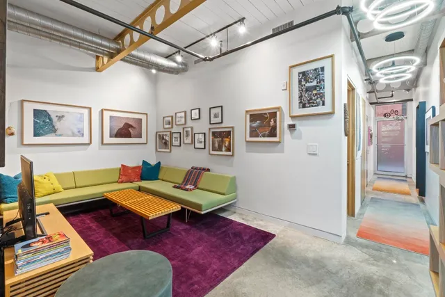 a living room with furniture and a rug