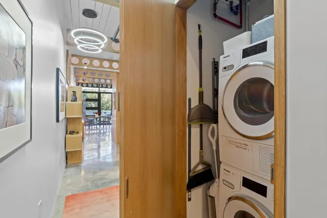a view of a hallway with washer and dryer