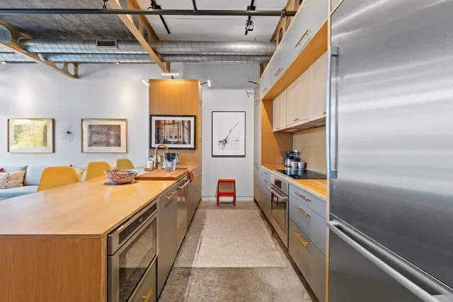 a kitchen with stainless steel appliances granite countertop lots of counter top space