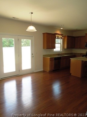 81 River Oak Street Spring Lake, NC 28390 - Photo 5 of 15 a view of kitchen with granite countertop window and wooden floor