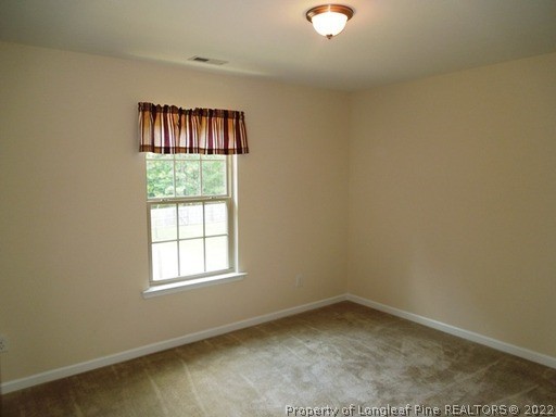 81 River Oak Street Spring Lake, NC 28390 - Photo 10 of 15 an empty room with a window