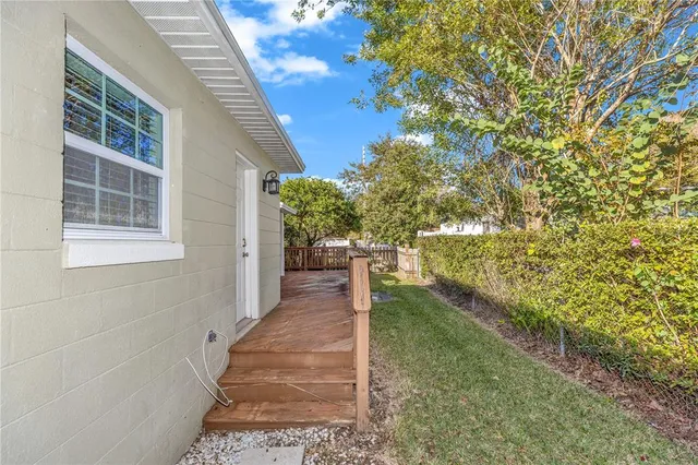a view of a pathway of a house with yard