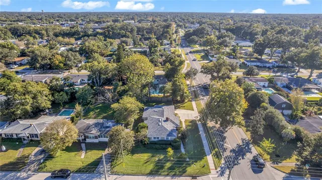 an aerial view of residential houses with outdoor space