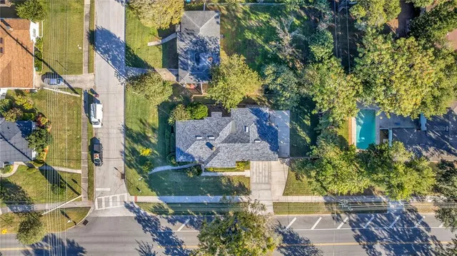 an aerial view of multiple houses with yard