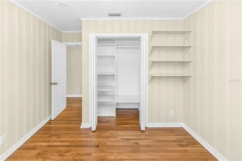 a bathroom with a granite countertop sink toilet a mirror and shower