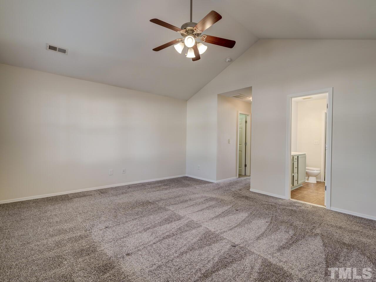 8219 Beaded Stone Street Raleigh, NC 27613 - Photo 23 of 45 a view of an empty room