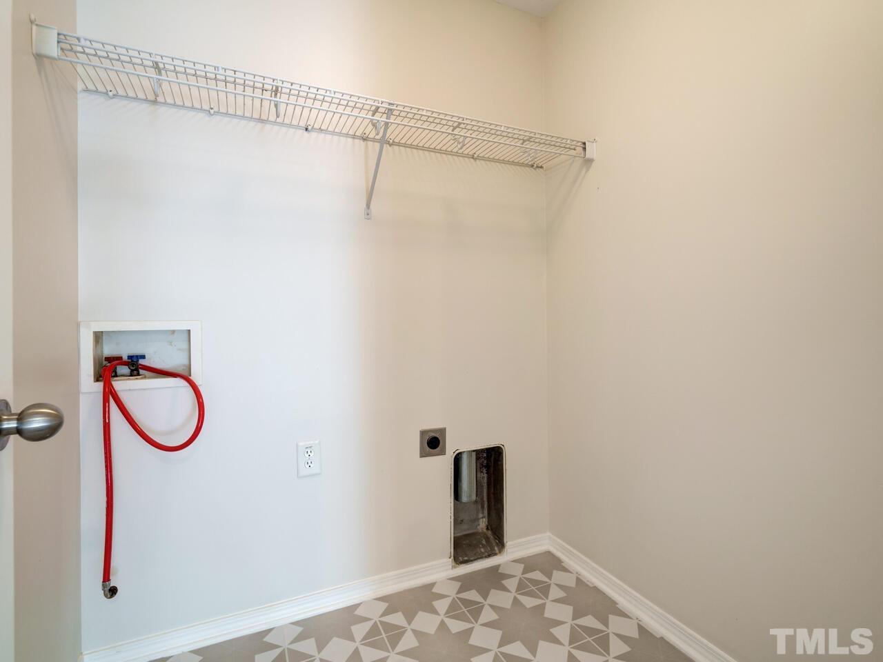 8219 Beaded Stone Street Raleigh, NC 27613 - Photo 27 of 45 a bathroom with a shower and a sink