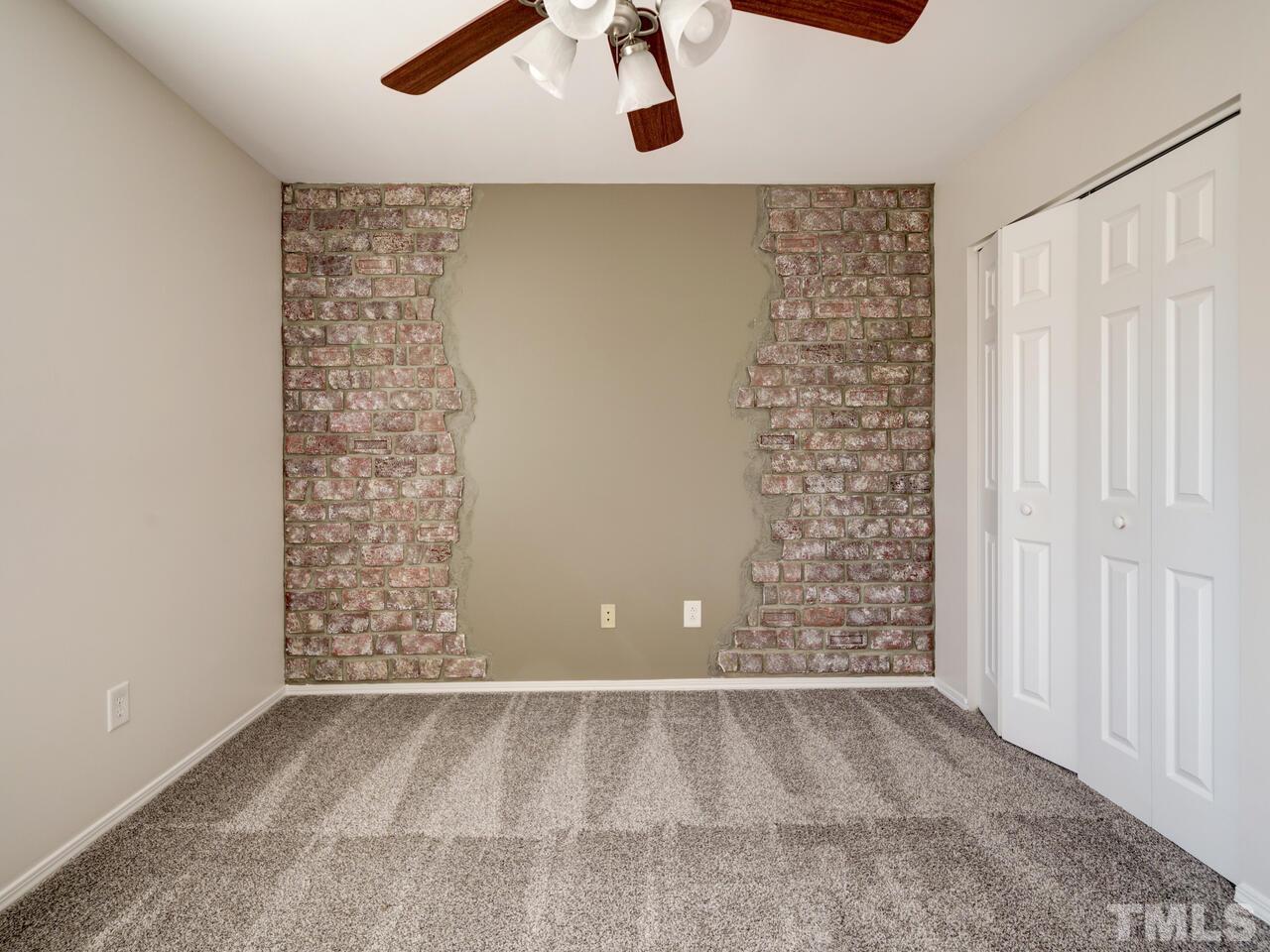 8219 Beaded Stone Street Raleigh, NC 27613 - Photo 33 of 45 a view of an empty room with a window