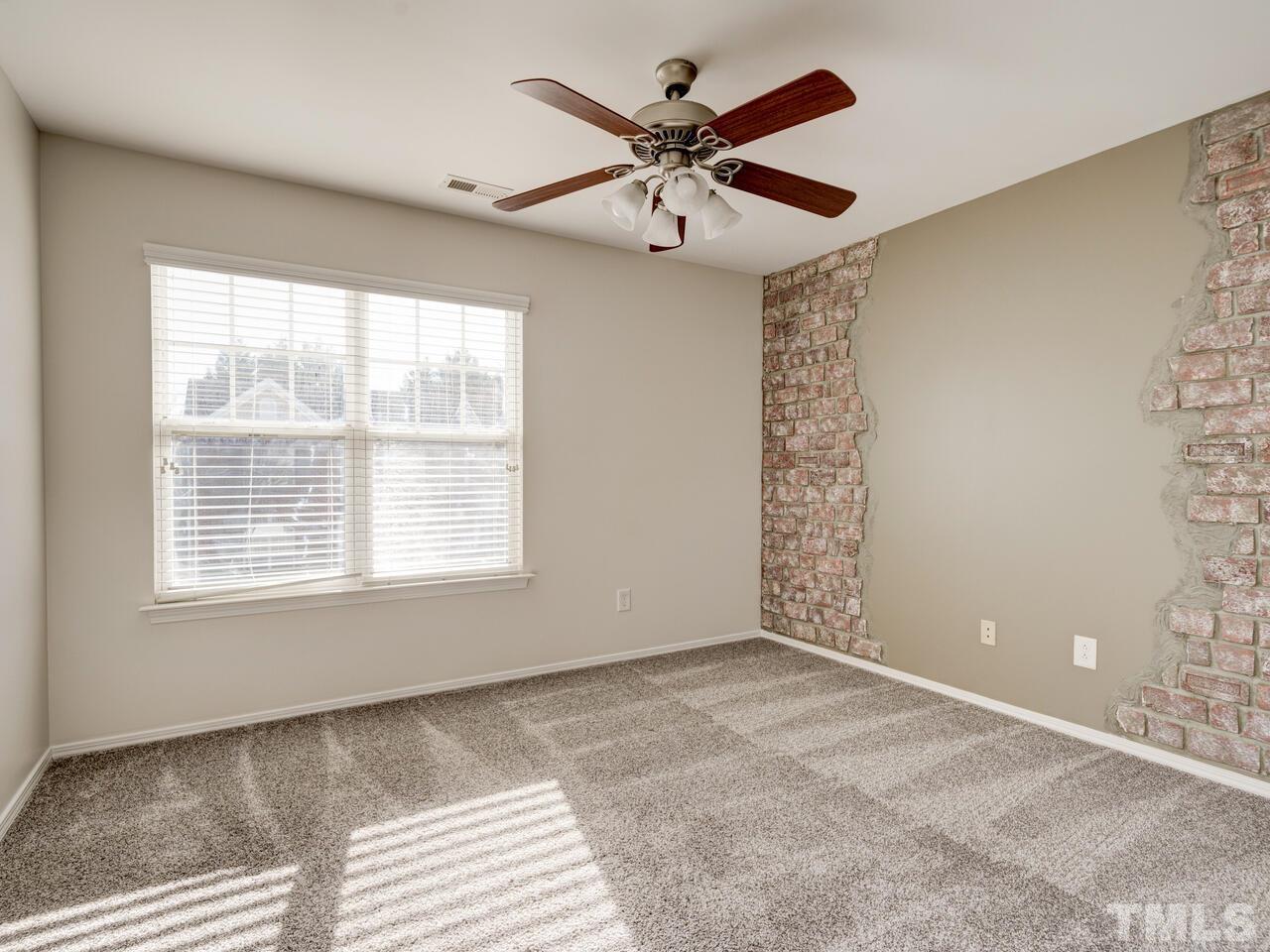 8219 Beaded Stone Street Raleigh, NC 27613 - Photo 35 of 45 a view of an empty room with a window