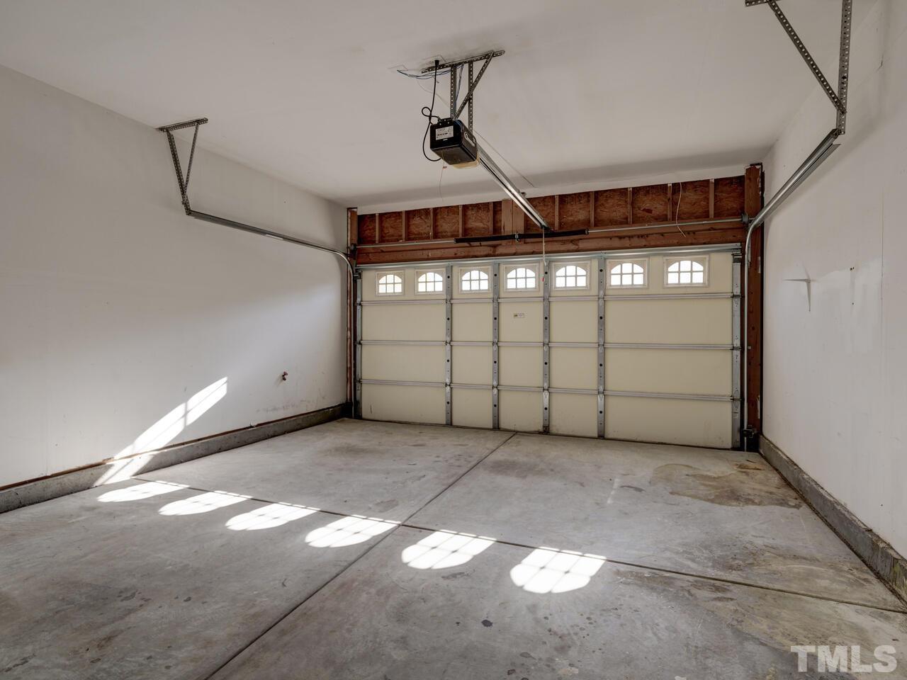 8219 Beaded Stone Street Raleigh, NC 27613 - Photo 37 of 45 a view of a garage