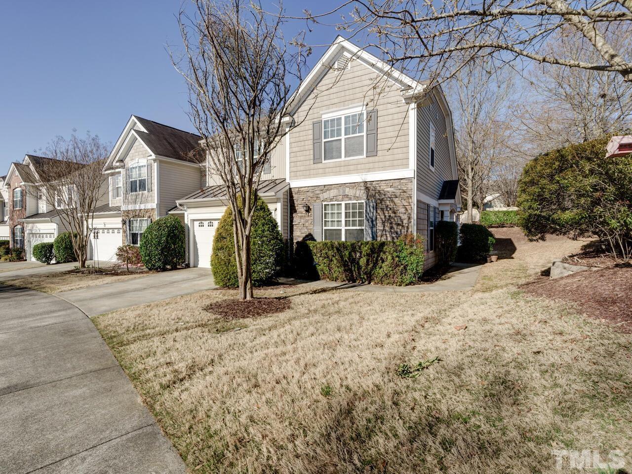 8219 Beaded Stone Street Raleigh, NC 27613 - Photo 38 of 45 a front view of a house with a yard