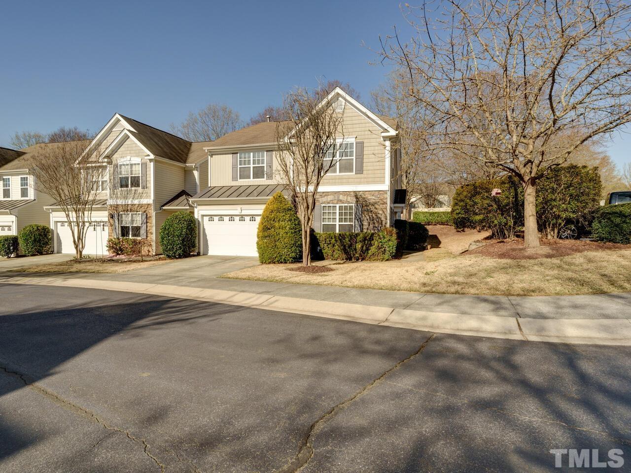 8219 Beaded Stone Street Raleigh, NC 27613 - Photo 44 of 45 a view of large house with a street