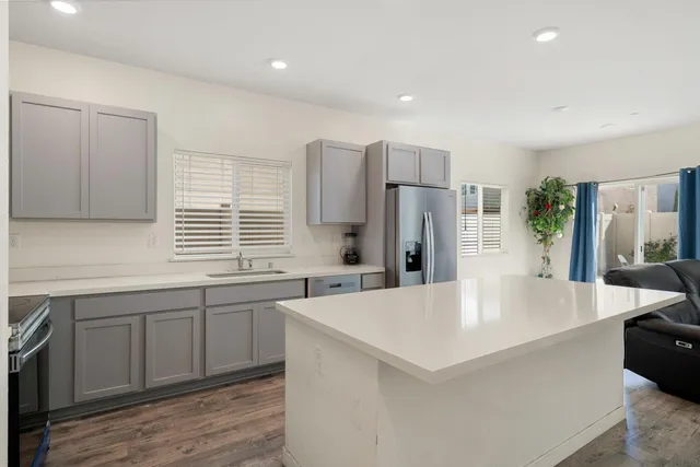 a kitchen with a sink stove and microwave