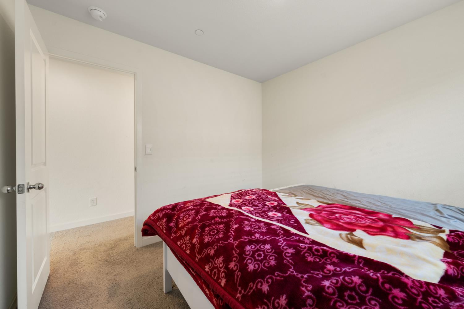 7664 Walpole Way Elk Grove, CA 95758 - Photo 21 of 43 a bedroom with a bed and a book shelf