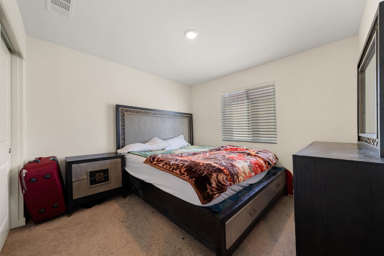 7664 Walpole Way Elk Grove, CA 95758 - Photo 25 of 43 a bedroom with a bed and a window
