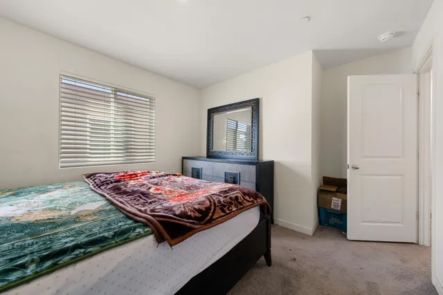 a kitchen with stainless steel appliances a refrigerator and a stove top oven