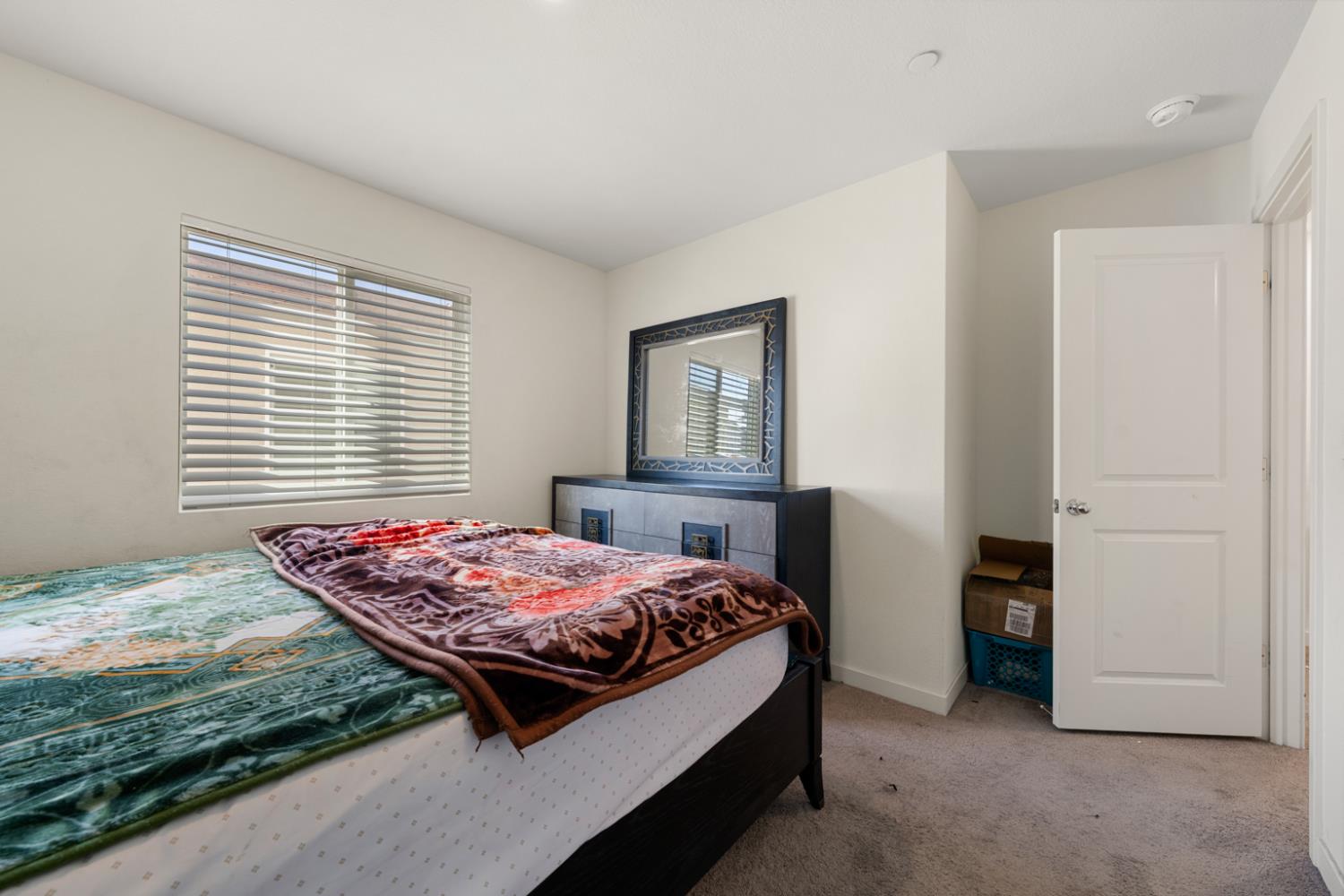 7664 Walpole Way Elk Grove, CA 95758 - Photo 26 of 43 a bedroom with a bed and a window