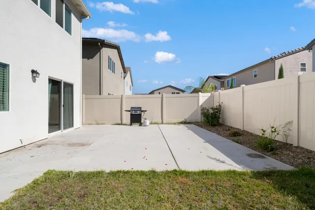 a view of a garage with a bike and car