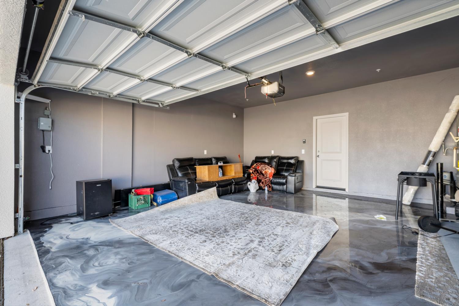 7664 Walpole Way Elk Grove, CA 95758 - Photo 41 of 43 a view of a garage with a bike and car