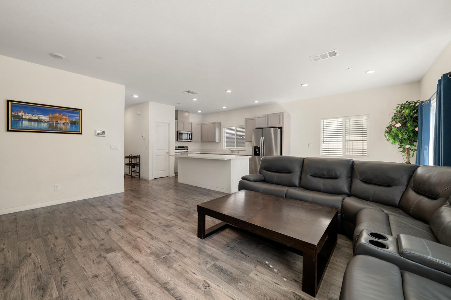 7664 Walpole Way Elk Grove, CA 95758 - Photo 8 of 43 a living room with furniture and a wooden floor