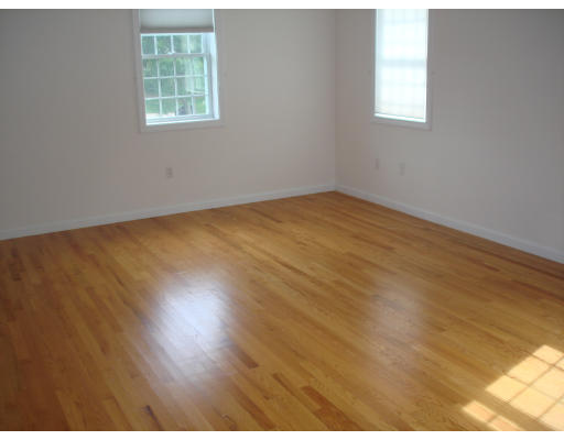 2 Old Farm Road Lunenburg, MA 01462 - Photo 14 of 19 an empty room with wooden floor and windows