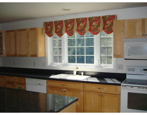 2 Old Farm Road Lunenburg, MA 01462 - Photo 10 of 19 a kitchen with a sink a stove and a window