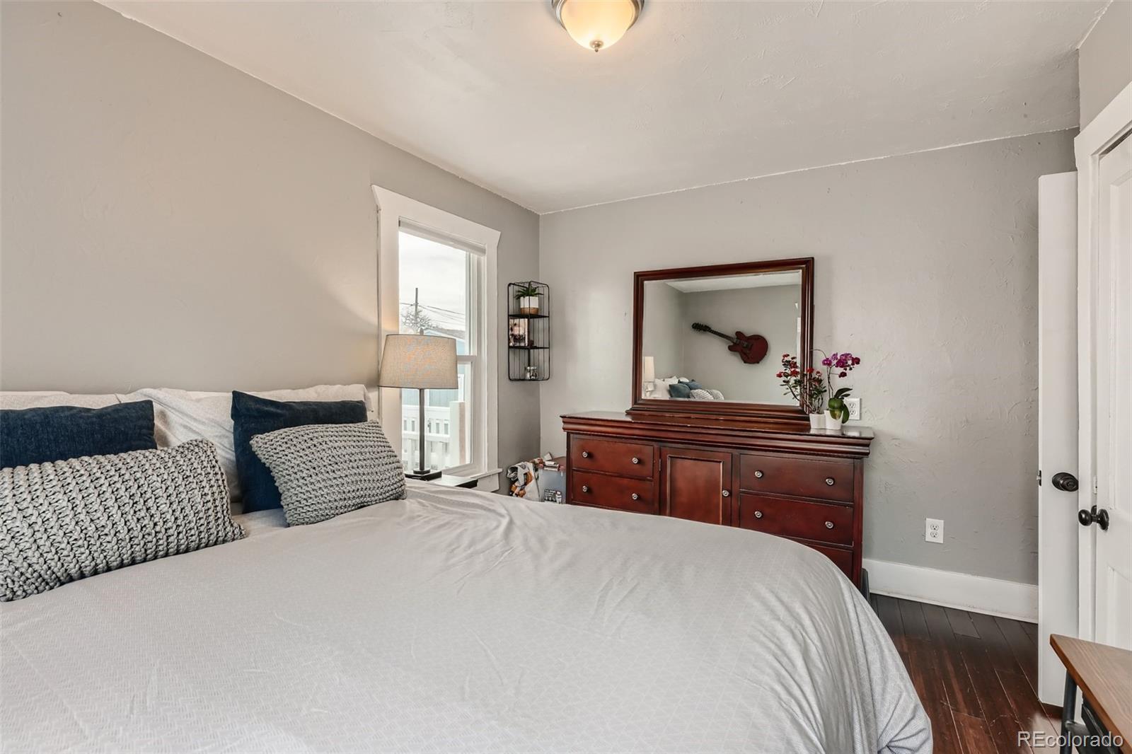 44 Julian Street Denver, CO 80219 - Photo 11 of 26 a bedroom with a bed and a window