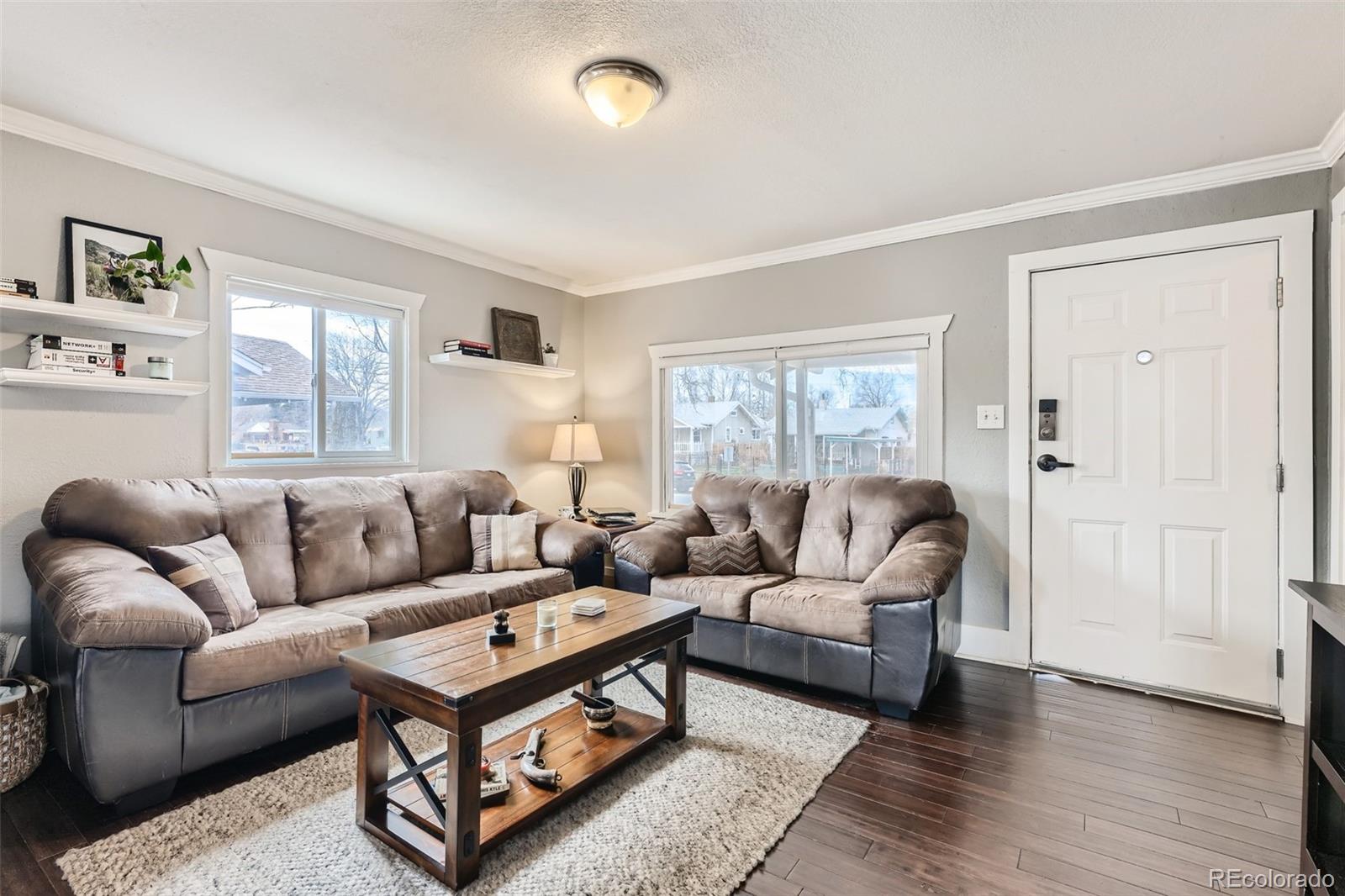 44 Julian Street Denver, CO 80219 - Photo 2 of 26 a living room with furniture and a window