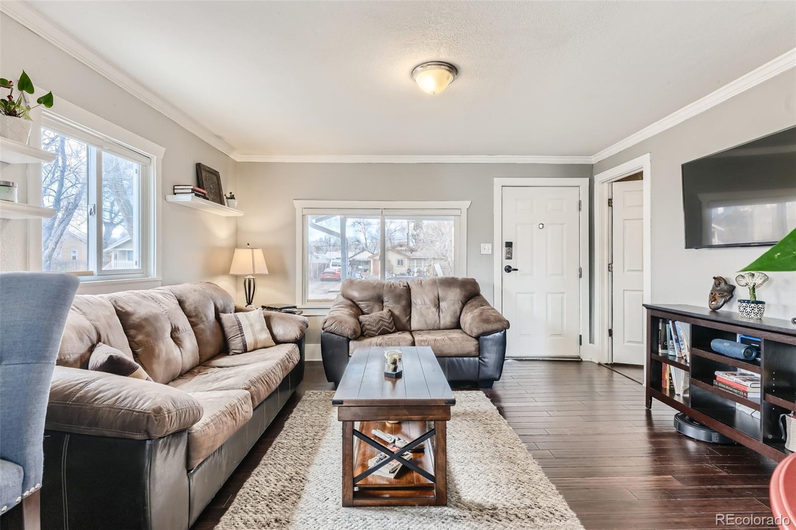 44 Julian Street Denver, CO 80219 - Photo 3 of 26 a living room with furniture and wooden floor