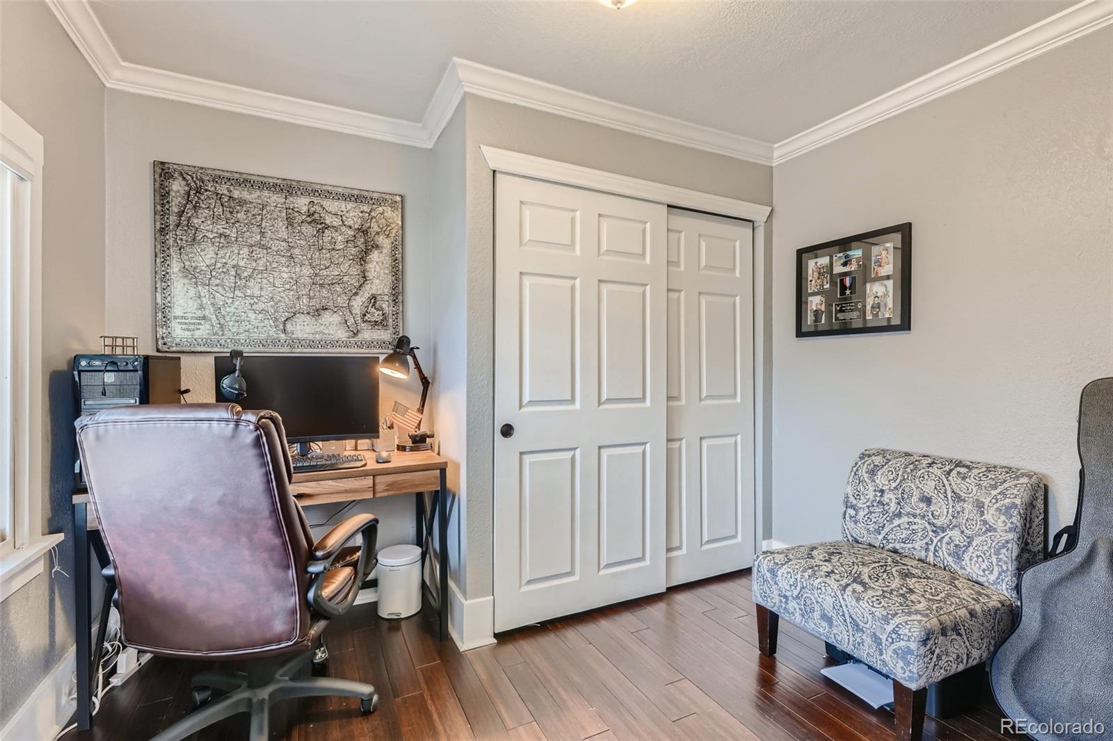44 Julian Street Denver, CO 80219 - Photo 5 of 26 a living room with furniture and a flat screen tv