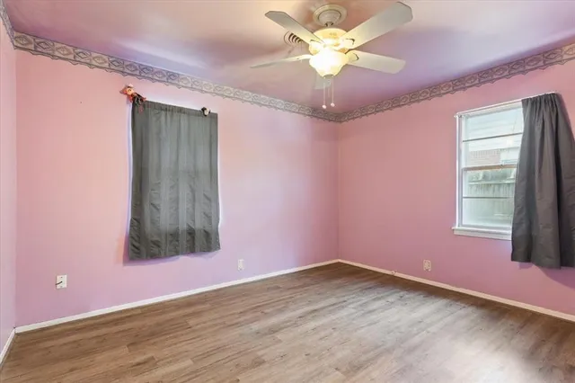 wooden floor that has a window in it