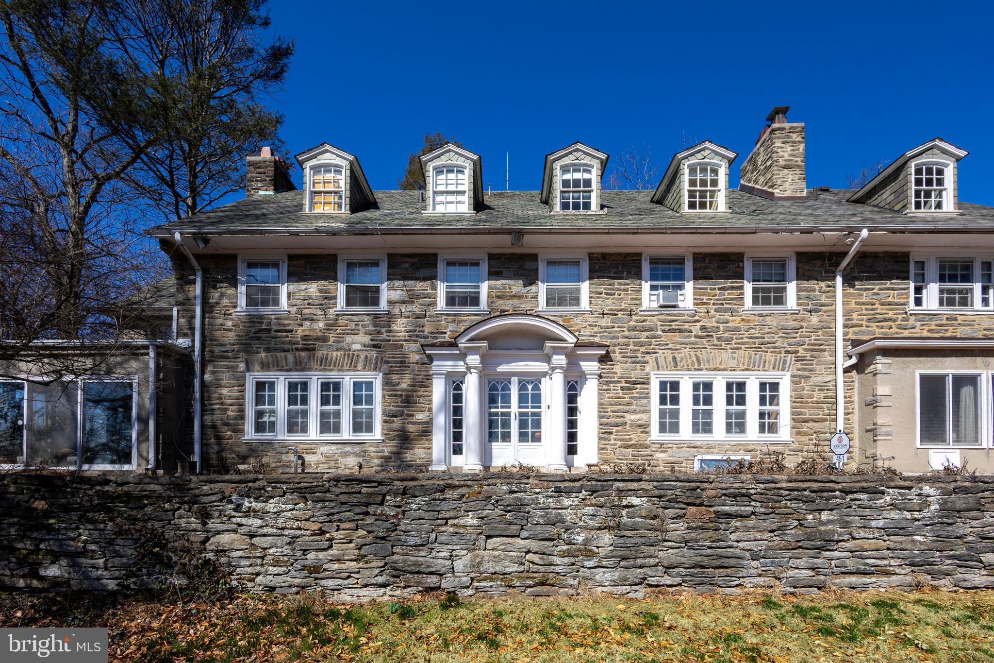 451 Merion Road Merion Station, PA 19066 - Photo 2 of 42 a front view of a house with lots of windows