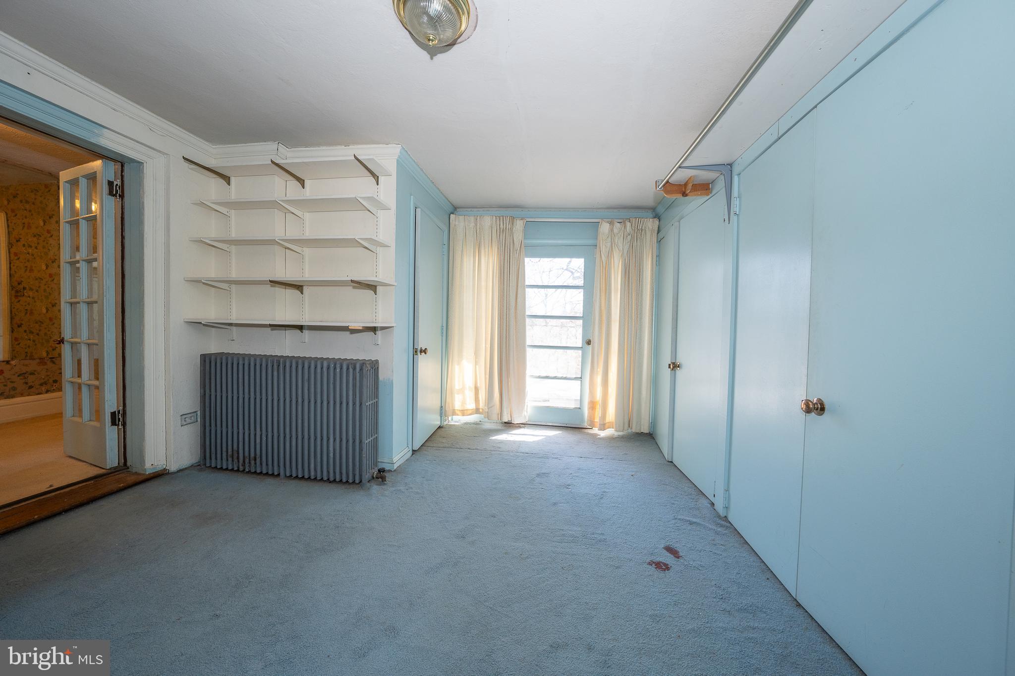 451 Merion Road Merion Station, PA 19066 - Photo 21 of 42 an empty room with windows and fireplace