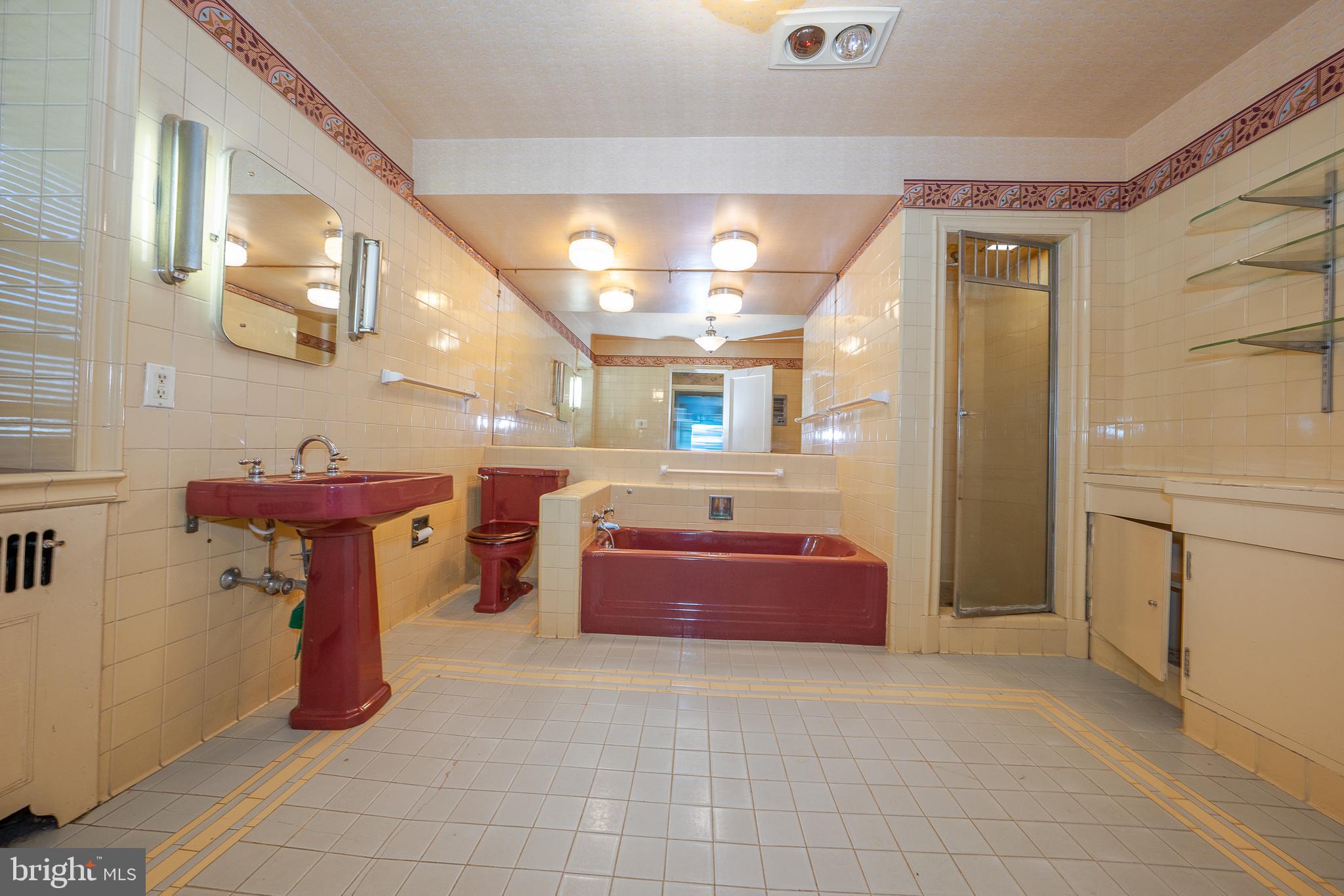 451 Merion Road Merion Station, PA 19066 - Photo 22 of 42 a bathroom with a tub sink and mirror