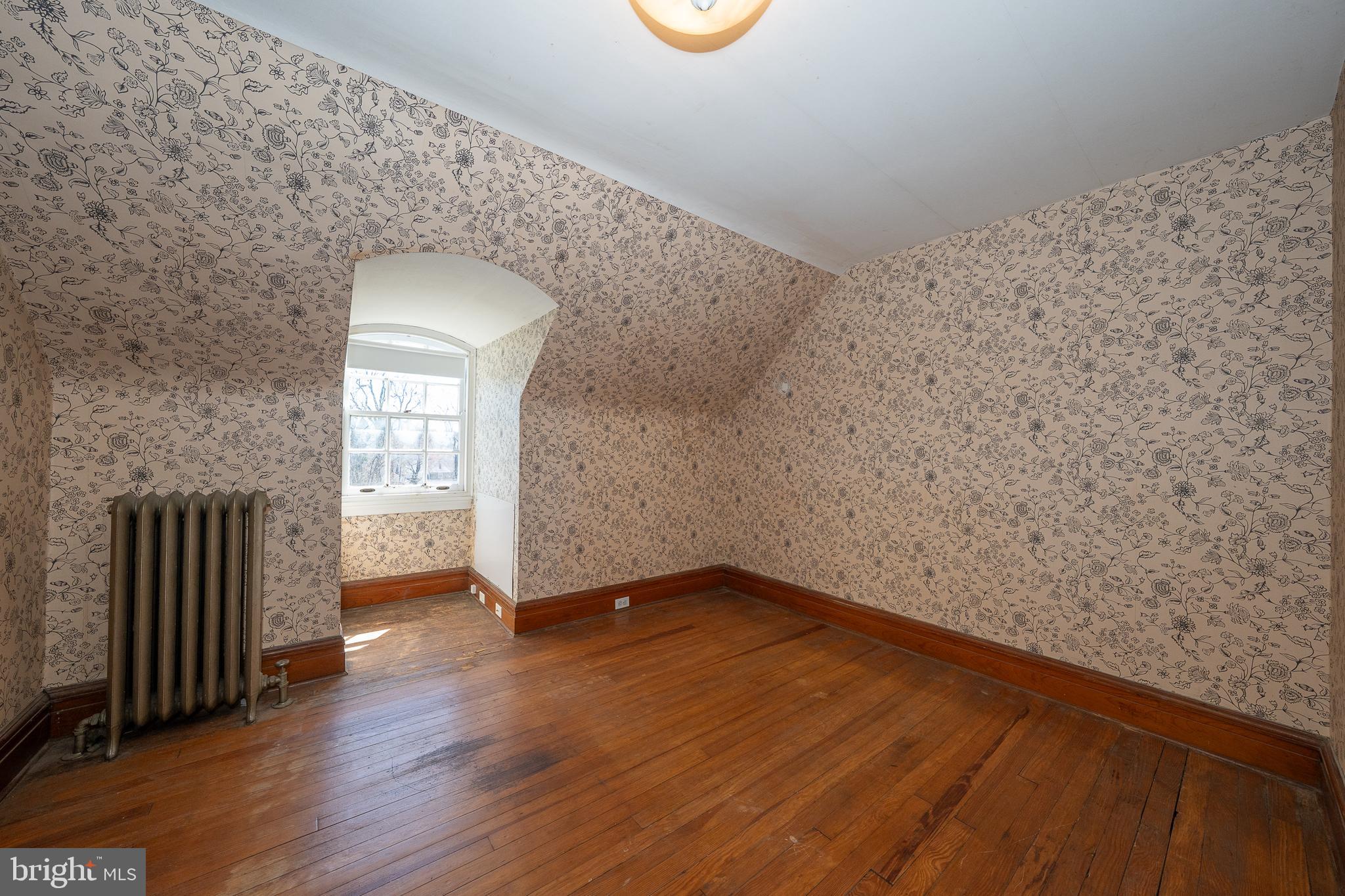 451 Merion Road Merion Station, PA 19066 - Photo 34 of 42 a view of an empty room with wooden floor and a window