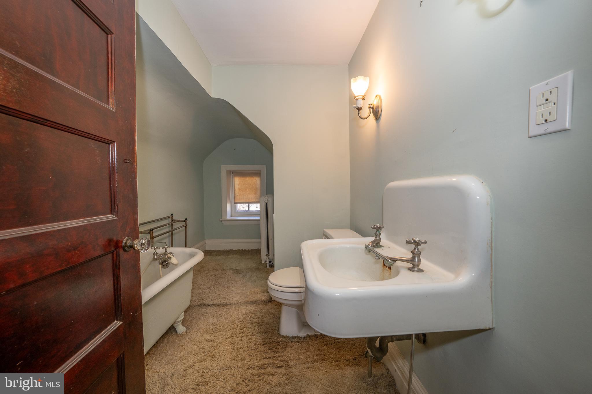 451 Merion Road Merion Station, PA 19066 - Photo 36 of 42 a bathroom with a sink toilet and a mirror