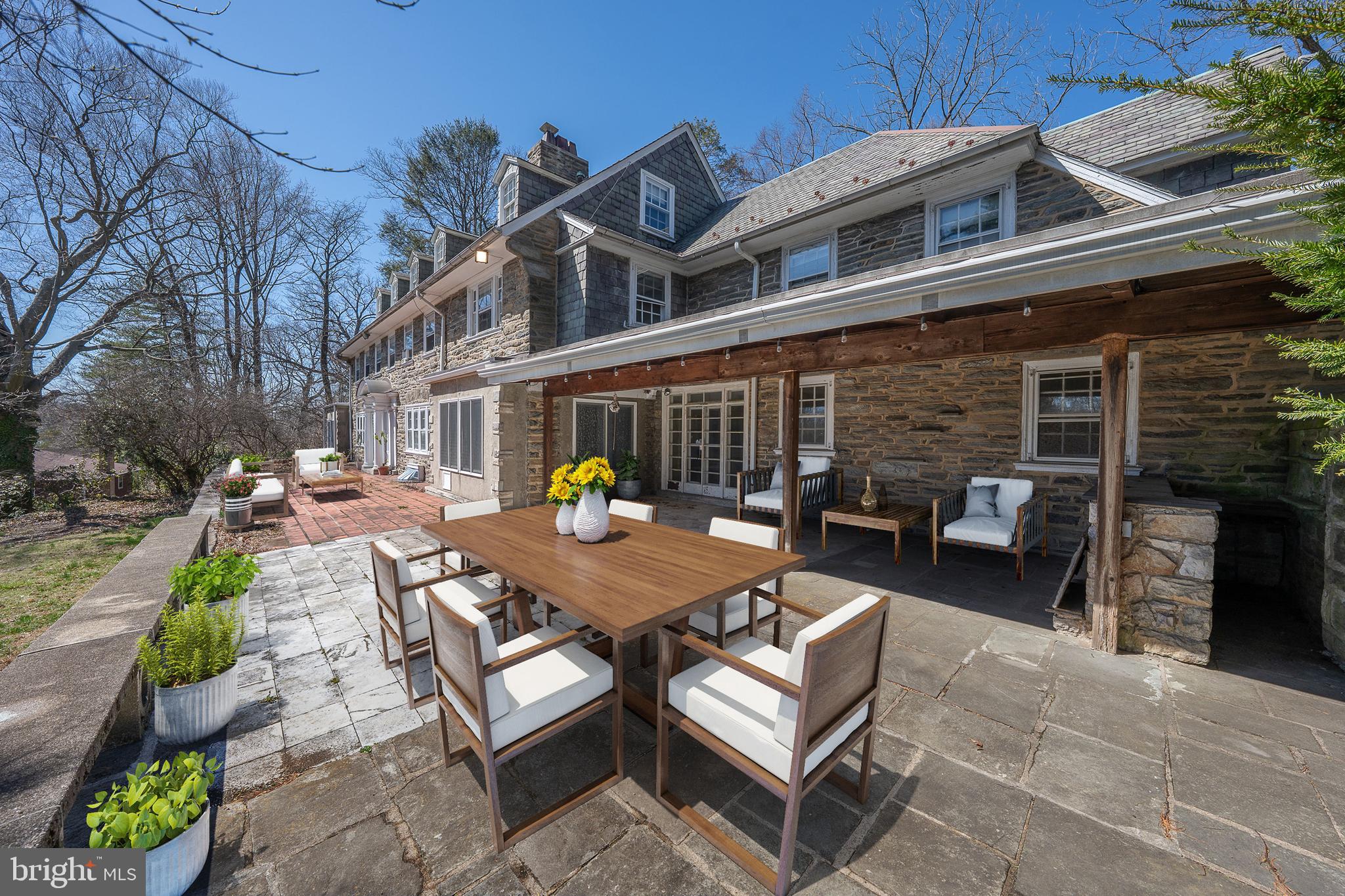 451 Merion Road Merion Station, PA 19066 - Photo 40 of 42 a view of a patio with couches table and chairs and potted plants