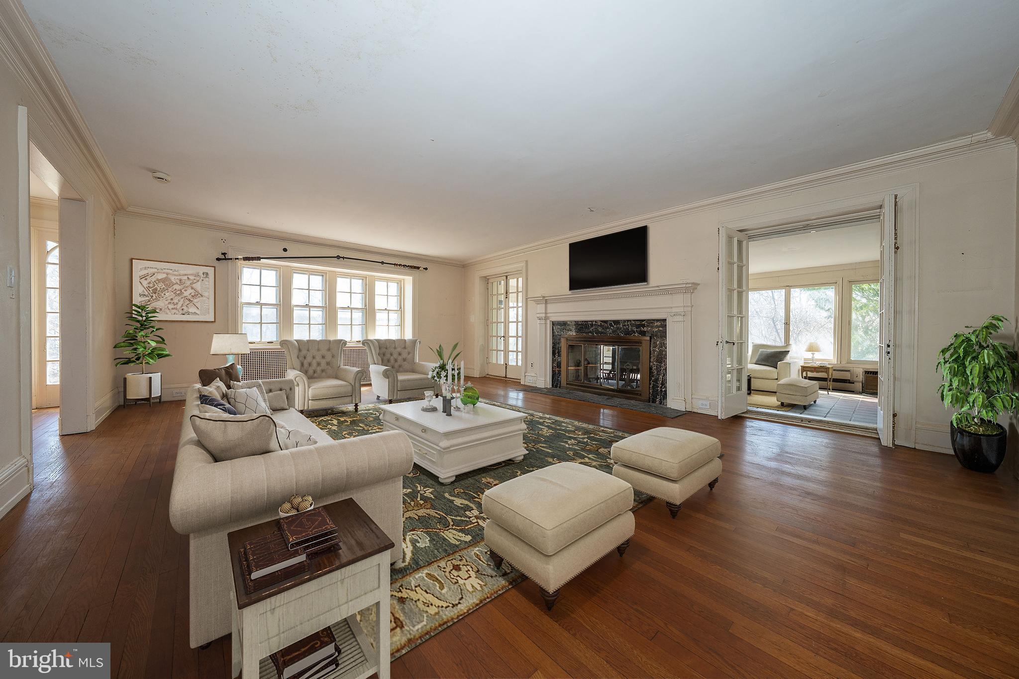 451 Merion Road Merion Station, PA 19066 - Photo 4 of 42 a living room with furniture fireplace and a flat screen tv