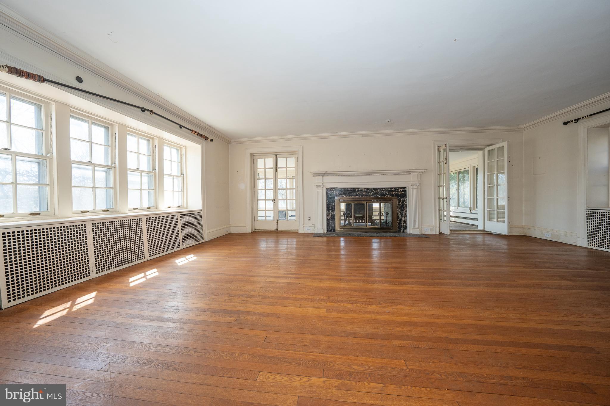 451 Merion Road Merion Station, PA 19066 - Photo 5 of 42 a view of an empty room with window and wooden floor