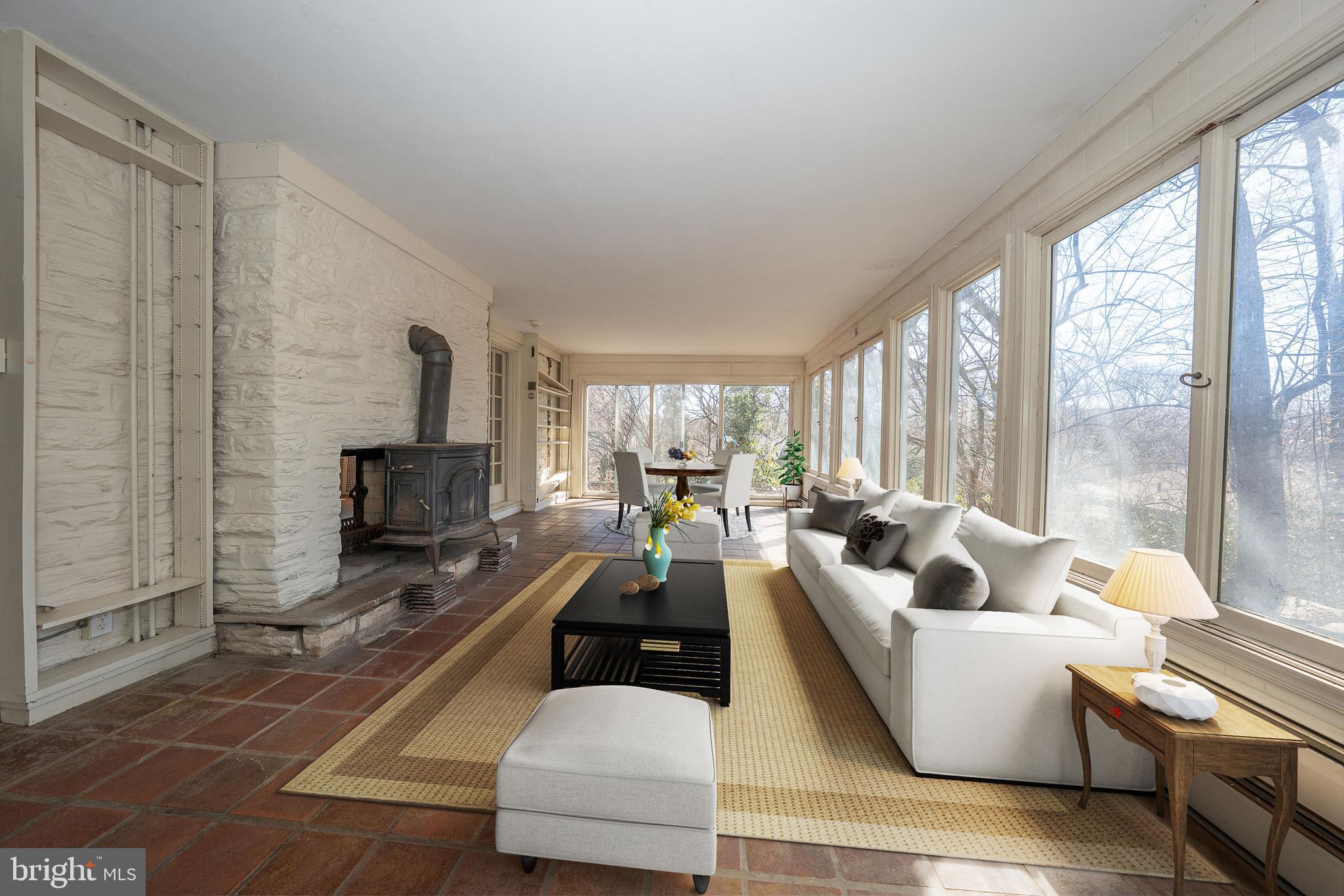 451 Merion Road Merion Station, PA 19066 - Photo 6 of 42 a living room with fireplace furniture and a flat screen tv