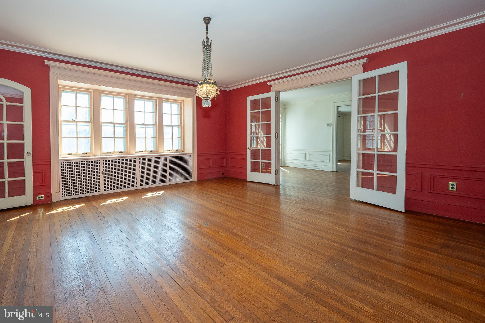 451 Merion Road Merion Station, PA 19066 - Photo 9 of 42 a view of an empty room with wooden floor and a window