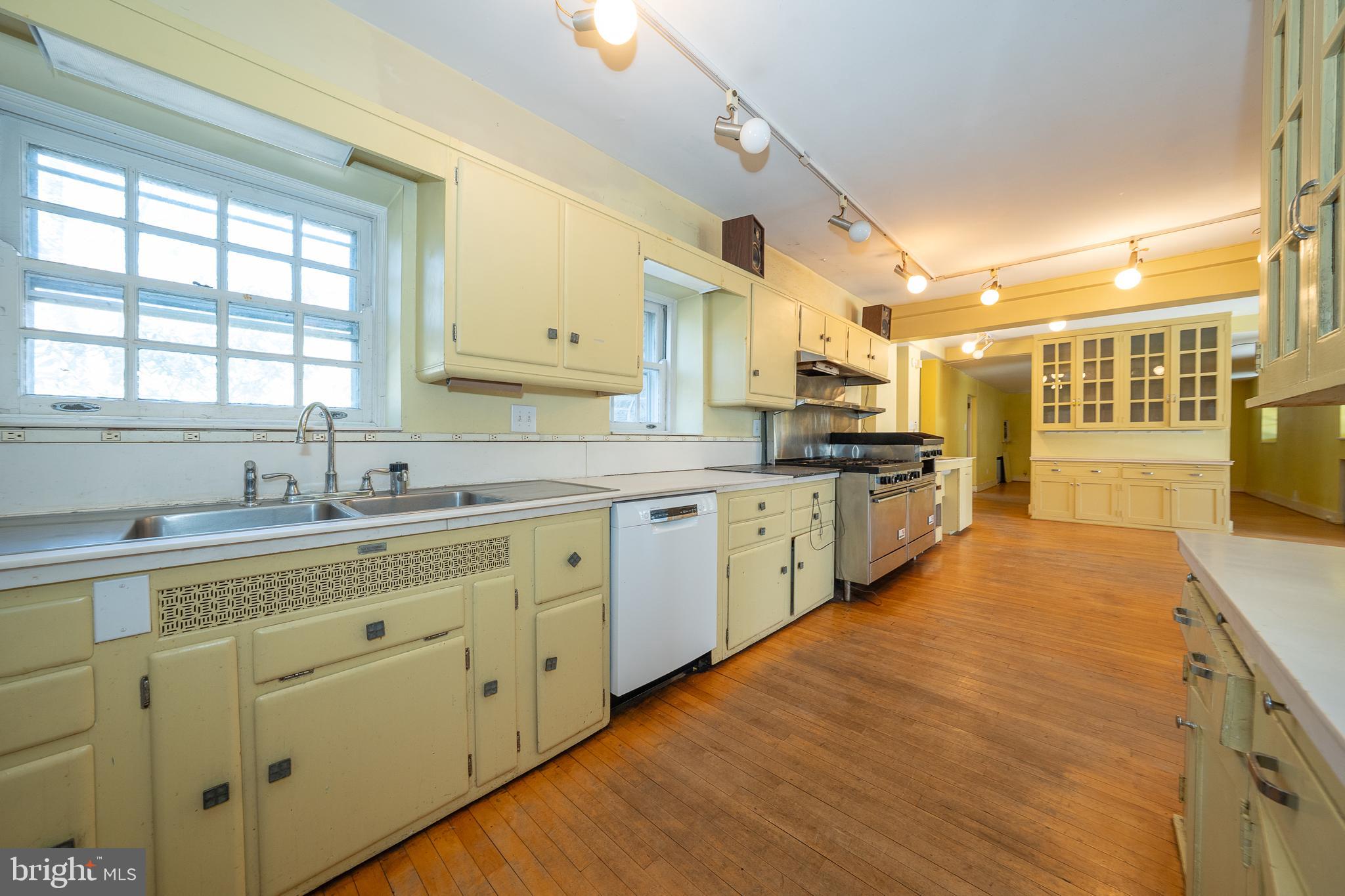 451 Merion Road Merion Station, PA 19066 - Photo 10 of 42 a large kitchen with kitchen island a sink stainless steel appliances and cabinets