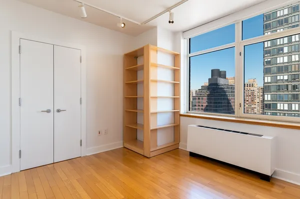 a view of a room with cabinet and a window