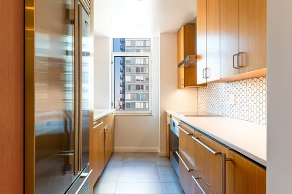 a kitchen with a table and chairs