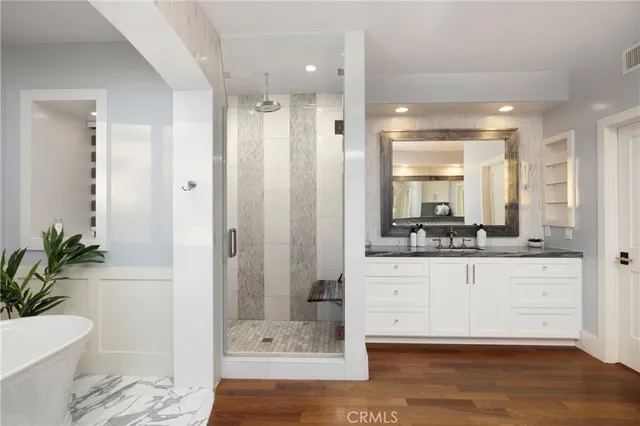 a bathroom with a double vanity sink and a mirror